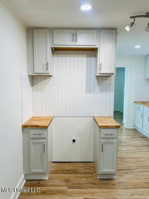 810 Louis Wilson Dr, Brandon, MS 39042 - kitchen with wooden counters, decorative backsplash, light wood-style floors, and recessed lighting