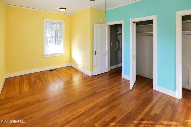 302 Decelle St, Jackson, MS 39216 - unfurnished bedroom featuring crown molding and wood finished floors
