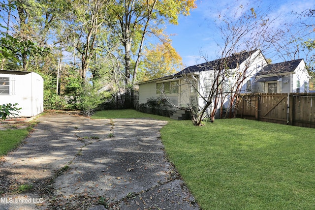 302 Decelle St, Jackson, MS 39216 - view of yard with a gate and a storage shed