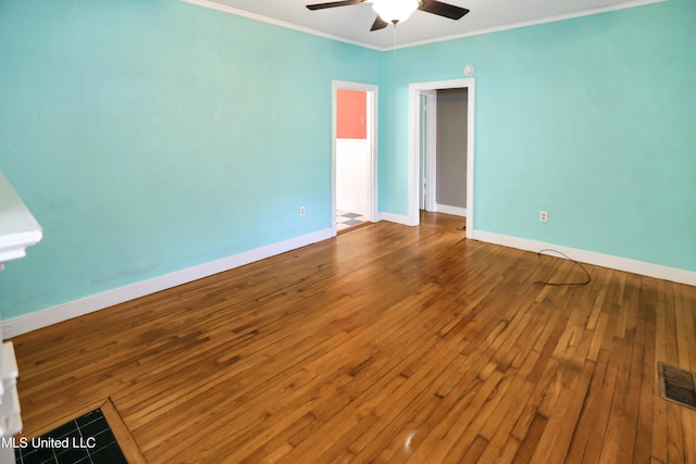 spare room with hardwood / wood-style flooring, ceiling fan, and ornamental molding