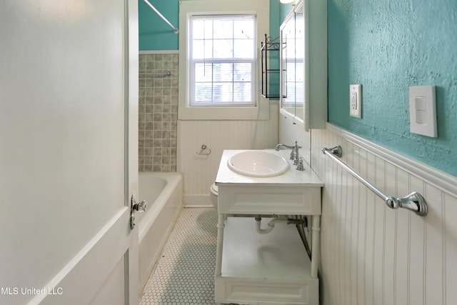 full bathroom with tile patterned flooring, vanity, toilet, and tiled shower / bath