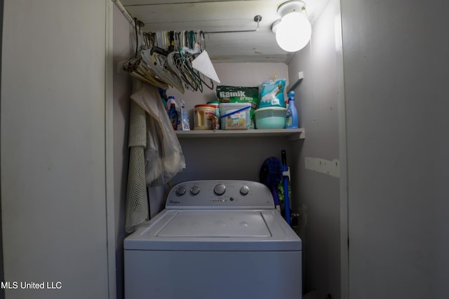 laundry area with laundry area and washer / clothes dryer