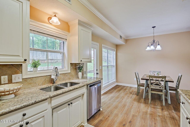 103 Cavitt Cv, Clinton, MS 39056 - kitchen with dishwasher, a sink, tasteful backsplash, light wood-type flooring, and ornamental molding