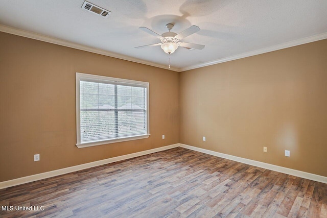 103 Cavitt Cv, Clinton, MS 39056 - empty room with crown molding, wood finished floors, ceiling fan, and baseboards