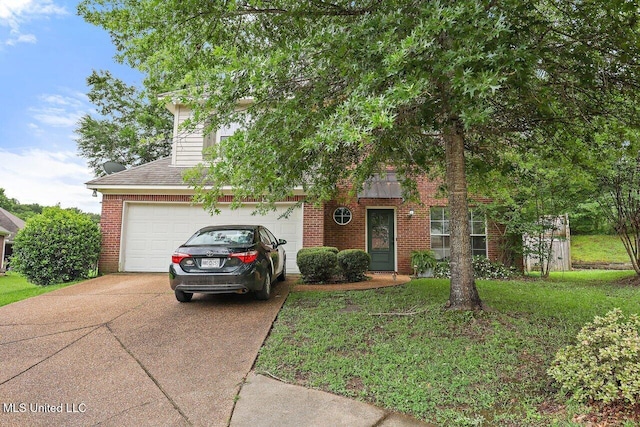 103 Cavitt Cv, Clinton, MS 39056 - view of property hidden behind natural elements with concrete driveway, brick siding, a front yard, and a shingled roof
