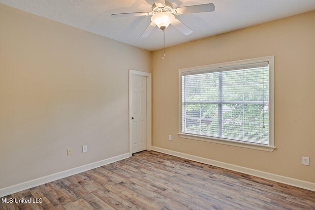 103 Cavitt Cv, Clinton, MS 39056 - spare room featuring wood finished floors, baseboards, and a ceiling fan