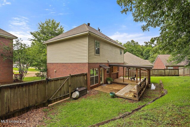 103 Cavitt Cv, Clinton, MS 39056 - back of house with a wooden deck, brick siding, and a gate