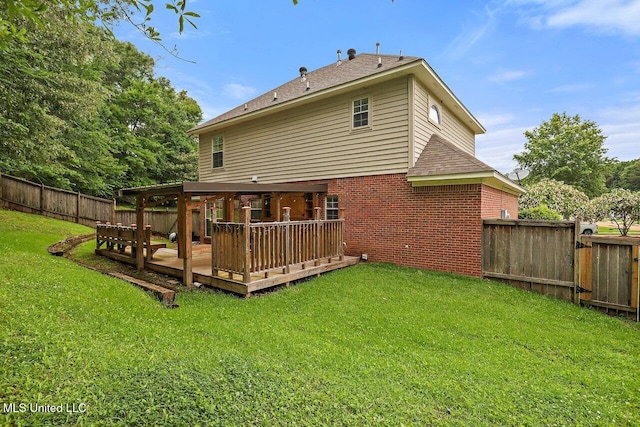 103 Cavitt Cv, Clinton, MS 39056 - back of house featuring brick siding, a wooden deck, and a shingled roof