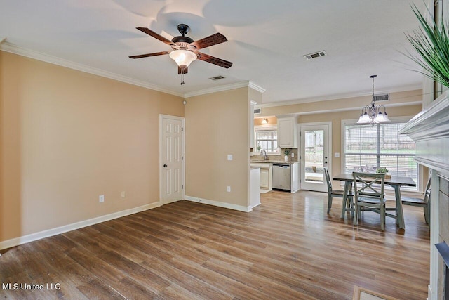 103 Cavitt Cv, Clinton, MS 39056 - unfurnished living room with ornamental molding, a sink, light wood-type flooring, ceiling fan, and baseboards