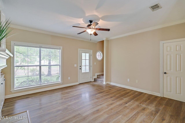 103 Cavitt Cv, Clinton, MS 39056 - entrance foyer with crown molding, light wood-style flooring, ceiling fan, baseboards, and stairway