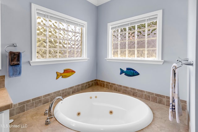 112 Vista Dr, Pass Christian, MS 39571 - bathroom featuring a jetted tub, healthy amount of natural light, and vanity