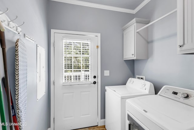 112 Vista Dr, Pass Christian, MS 39571 - laundry area with washing machine and clothes dryer, cabinet space, and crown molding