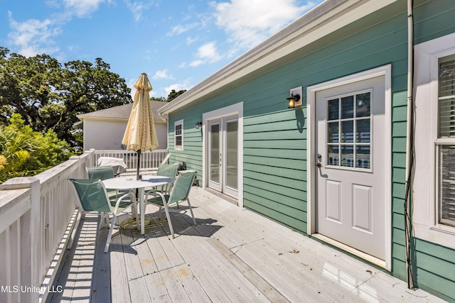 112 Vista Dr, Pass Christian, MS 39571 - wooden deck featuring outdoor dining space