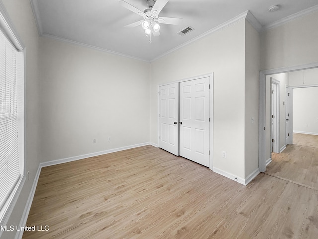 290 Geneva Blvd, Madison, MS 39110 - unfurnished bedroom featuring ornamental molding, light wood-style floors, a closet, and a ceiling fan