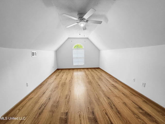 290 Geneva Blvd, Madison, MS 39110 - additional living space with wood finished floors, vaulted ceiling, and a ceiling fan