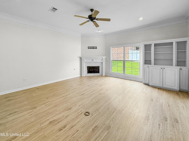 290 Geneva Blvd, Madison, MS 39110 - unfurnished living room with crown molding, light wood-style floors, ceiling fan, a brick fireplace, and recessed lighting