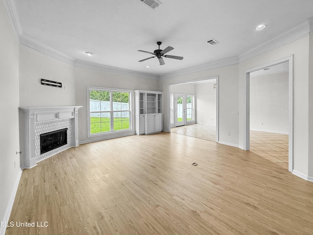 290 Geneva Blvd, Madison, MS 39110 - unfurnished living room featuring crown molding, ceiling fan, healthy amount of natural light, light wood-style flooring, and a fireplace