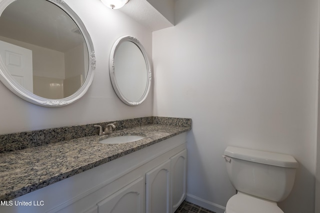 16601 Mcgregor Rd, Vancleave, MS 39565 - half bath featuring toilet, vanity, and baseboards