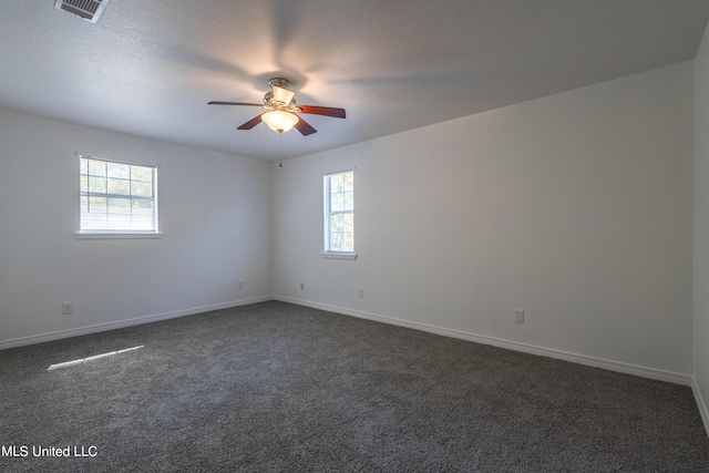 16601 Mcgregor Rd, Vancleave, MS 39565 - spare room featuring ceiling fan, dark colored carpet, and baseboards