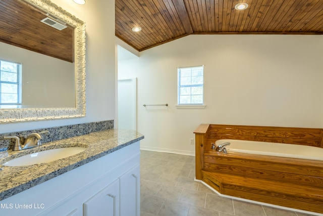 16601 Mcgregor Rd, Vancleave, MS 39565 - full bath featuring wooden ceiling, healthy amount of natural light, vaulted ceiling, vanity, and a garden tub