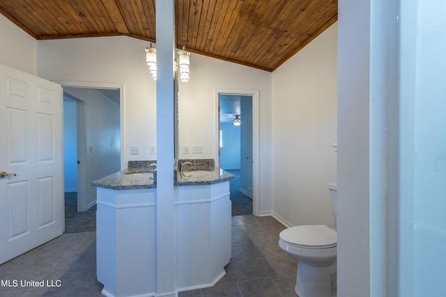 16601 Mcgregor Rd, Vancleave, MS 39565 - bathroom featuring wood ceiling, vaulted ceiling, tile patterned floors, toilet, and vanity