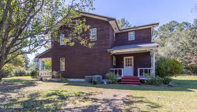 view of front of house featuring a front yard and a porch