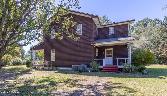 16601 Mcgregor Rd, Vancleave, MS 39565 - view of front facade featuring a front lawn and cooling unit