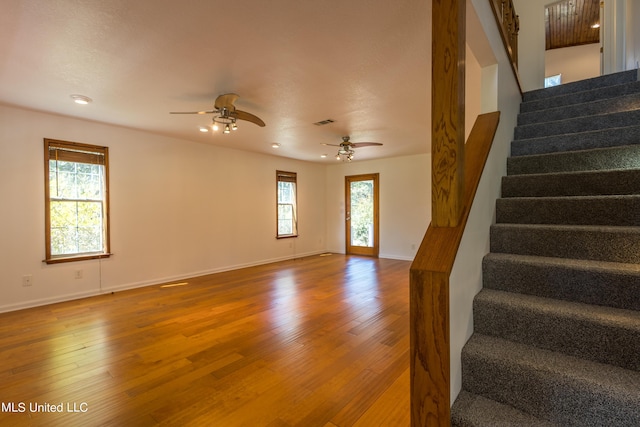 16601 Mcgregor Rd, Vancleave, MS 39565 - stairway with ceiling fan, baseboards, wood finished floors, and recessed lighting