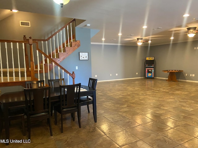 dining room featuring ornamental molding and ceiling fan