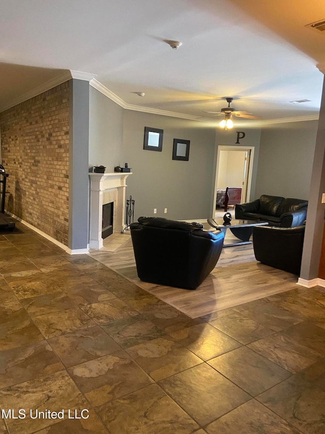 living room featuring crown molding, brick wall, and ceiling fan