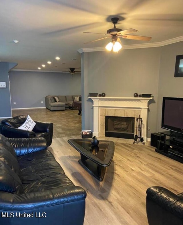 6301 W Wimbledon Cv, Ocean Springs, MS 39564 - living area with ornamental molding, a fireplace, baseboards, recessed lighting, and a ceiling fan