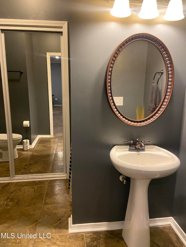 bathroom featuring sink and toilet