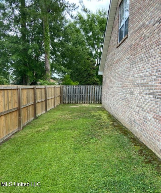 6301 W Wimbledon Cv, Ocean Springs, MS 39564 - view of yard featuring a fenced backyard