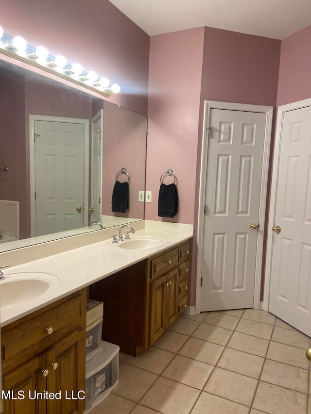 bathroom with vanity and tile patterned flooring