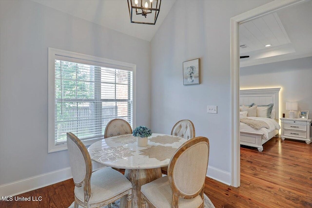 1235 Cutter Ln, Brandon, MS 39047 - dining room with healthy amount of natural light, wood finished floors, and vaulted ceiling