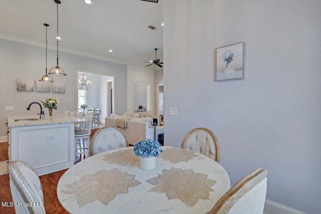 1235 Cutter Ln, Brandon, MS 39047 - dining area featuring crown molding, a ceiling fan, dark wood-style flooring, recessed lighting, and a chandelier