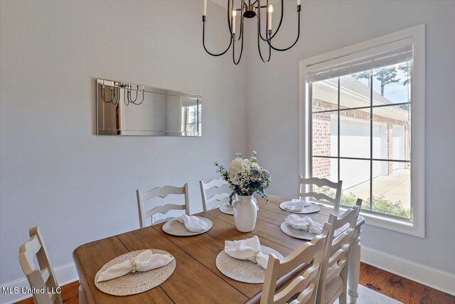 1235 Cutter Ln, Brandon, MS 39047 - dining area featuring healthy amount of natural light, a chandelier, and wood finished floors