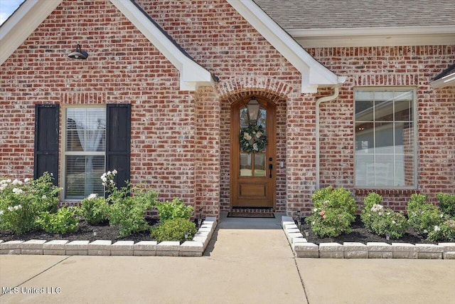 1235 Cutter Ln, Brandon, MS 39047 - view of exterior entry featuring brick siding and a shingled roof