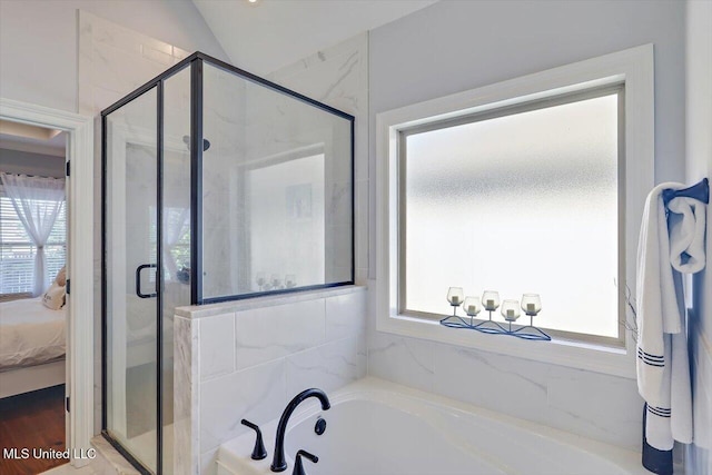 1235 Cutter Ln, Brandon, MS 39047 - ensuite bathroom with a bath, a shower stall, and lofted ceiling