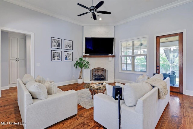 1235 Cutter Ln, Brandon, MS 39047 - living area with ceiling fan, a fireplace, dark wood-type flooring, crown molding, and recessed lighting
