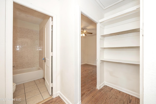2411 12th St, Pascagoula, MS 39567 - bathroom featuring toilet and wood finished floors