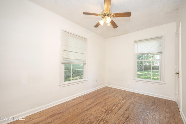 2411 12th St, Pascagoula, MS 39567 - empty room featuring wood finished floors, a textured ceiling, a ceiling fan, and crown molding