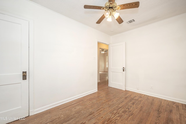 2411 12th St, Pascagoula, MS 39567 - unfurnished room featuring ceiling fan, wood finished floors, and a textured ceiling
