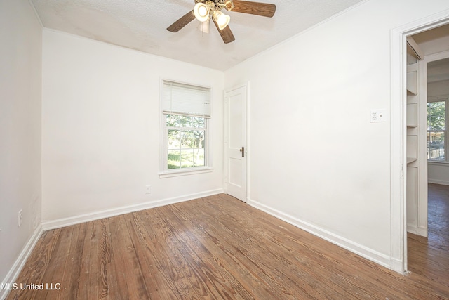 2411 12th St, Pascagoula, MS 39567 - unfurnished room featuring wood finished floors and a ceiling fan