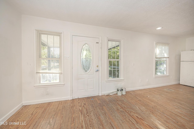 2411 12th St, Pascagoula, MS 39567 - entrance foyer featuring wood finished floors and a textured ceiling
