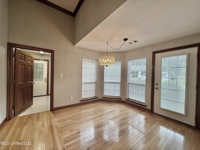 110 Frye Rd, Hattiesburg, MS 39401 - unfurnished dining area with light wood finished floors, a chandelier, and baseboards