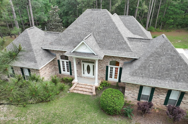 110 Frye Rd, Hattiesburg, MS 39401 - view of front of house featuring french doors, roof with shingles, brick siding, and a front yard