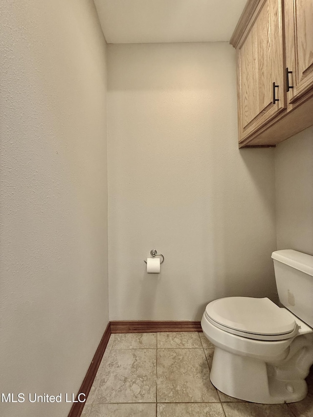 110 Frye Rd, Hattiesburg, MS 39401 - bathroom featuring toilet, baseboards, and tile patterned flooring