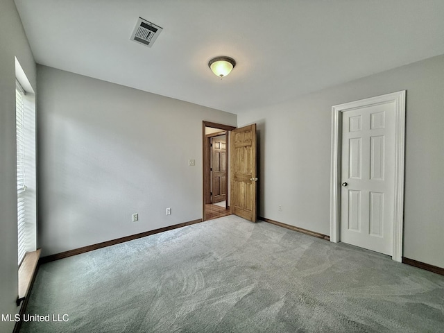 110 Frye Rd, Hattiesburg, MS 39401 - unfurnished bedroom featuring carpet and baseboards