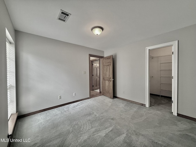 110 Frye Rd, Hattiesburg, MS 39401 - unfurnished bedroom with carpet floors, baseboards, and a spacious closet